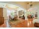 Open floor plan with hardwood floors and a dining table set for a meal at 813 Cotton Creek Dr, Canton, GA 30115
