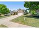 Beautiful two-story home featuring a long driveway and lush green lawn at 813 Cotton Creek Dr, Canton, GA 30115