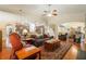 Bright living room with hardwood floors, open to kitchen, and a cozy seating arrangement at 813 Cotton Creek Dr, Canton, GA 30115