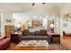 Comfortable living room featuring hardwood floors and an open floor plan leading into the kitchen at 813 Cotton Creek Dr, Canton, GA 30115