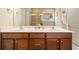Bright main bathroom boasts double sinks, a walk-in shower, and custom vanity with plenty of storage at 813 Cotton Creek Dr, Canton, GA 30115