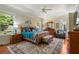 Spacious main bedroom with tray ceilings, hardwood floors, and large windows offering plenty of natural light at 813 Cotton Creek Dr, Canton, GA 30115