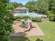 A playground and community pool nestled among greenery and manicured lawns at 813 Cotton Creek Dr, Canton, GA 30115
