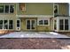 Home's backyard featuring a patio and a grassy area at 9050 Brockham Way, Alpharetta, GA 30022