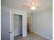 Bedroom with a ceiling fan, closet and neutral paint at 9050 Brockham Way, Alpharetta, GA 30022