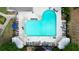 Overhead shot of a well-maintained community pool with many lounge chairs at 9050 Brockham Way, Alpharetta, GA 30022