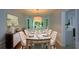 Elegant dining room with marble table, seating for eight, and stylish buffet with mirror at 9050 Brockham Way, Alpharetta, GA 30022