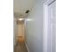 Hallway with hardwood floors and neutral walls provides access to rooms at 9050 Brockham Way, Alpharetta, GA 30022