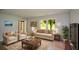 Well-lit living room with comfortable furniture and a view of the outdoors at 9050 Brockham Way, Alpharetta, GA 30022