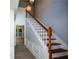 View of the bright staircase with hardwood steps and white banisters at 9050 Brockham Way, Alpharetta, GA 30022