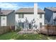 Backyard featuring a wooden deck, a patio, and well-maintained lawn at 5712 Grande River Rd, Atlanta, GA 30349