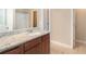 Bathroom vanity with granite countertop, and access to shower, tub and toilet at 5712 Grande River Rd, Atlanta, GA 30349