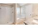 Bathroom with a tub, a step-in shower with white fixtures, and a granite countertop at 5712 Grande River Rd, Atlanta, GA 30349