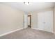 Bright bedroom with carpet, closet, neutral paint and recessed lighting at 5712 Grande River Rd, Atlanta, GA 30349