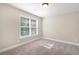 Neutral bedroom with neutral carpet, paint, and trim at 5712 Grande River Rd, Atlanta, GA 30349