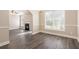 Bright dining room boasts updated flooring, neutral paint, and an open layout great for entertaining at 5712 Grande River Rd, Atlanta, GA 30349