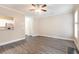 Open living room featuring hardwood floors, neutral walls, and natural light, perfect for entertaining at 5712 Grande River Rd, Atlanta, GA 30349