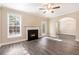 Bright living room boasts a cozy fireplace, updated flooring, and an open layout great for entertaining at 5712 Grande River Rd, Atlanta, GA 30349