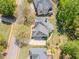 Stunning aerial view of home with mature trees, lush landscaping, and a spacious driveway at 710 Bentgrass Ct, Dacula, GA 30019