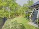 Expansive backyard with lush greenery and steps leading to outdoor enjoyment at 710 Bentgrass Ct, Dacula, GA 30019