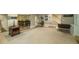 Finished basement with beige carpet, neutral walls, and decorative rugs at 710 Bentgrass Ct, Dacula, GA 30019