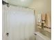 Bathroom featuring a decorative curtain and towel racks for a stylish touch at 710 Bentgrass Ct, Dacula, GA 30019