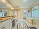 Spacious bathroom featuring a soaking tub, a glass shower, and double vanity with granite countertop at 710 Bentgrass Ct, Dacula, GA 30019