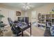 Functional bedroom featuring a desk, shelves, and a window for a productive work space at 710 Bentgrass Ct, Dacula, GA 30019