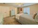 Comfortable bedroom with neutral tones, carpet, and a ceiling fan for a cozy atmosphere at 710 Bentgrass Ct, Dacula, GA 30019