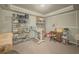 Spacious room with storage racks and desk at 710 Bentgrass Ct, Dacula, GA 30019