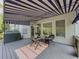 Exterior view of shaded deck with awning and outdoor furniture at 710 Bentgrass Ct, Dacula, GA 30019