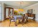 Sunlit dining room with hardwood floors and traditional-style furniture at 710 Bentgrass Ct, Dacula, GA 30019
