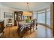 Elegant dining room with crown molding, hardwood floors, and large windows at 710 Bentgrass Ct, Dacula, GA 30019