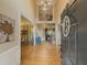 Grand foyer with high ceilings, hardwood floors, and a view of the second-story balcony at 710 Bentgrass Ct, Dacula, GA 30019
