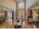Elegant foyer with hardwood floors, wainscoting, and a view into the formal dining and living areas at 710 Bentgrass Ct, Dacula, GA 30019