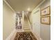 Spacious hallway featuring beautiful decorations and access to the staircase at 710 Bentgrass Ct, Dacula, GA 30019