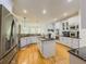 Bright and airy kitchen with stainless steel appliances and granite countertops at 710 Bentgrass Ct, Dacula, GA 30019
