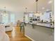 Bright, open kitchen features a large island with bar seating and stainless steel appliances at 710 Bentgrass Ct, Dacula, GA 30019