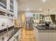 Well-lit kitchen featuring stainless steel refrigerator, granite countertops, and eat in area at 710 Bentgrass Ct, Dacula, GA 30019