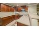 Basement kitchenette with wooden cabinets, granite countertops, and stainless steel appliances at 710 Bentgrass Ct, Dacula, GA 30019
