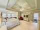 Main bedroom features tray ceilings, ceiling fan, sitting area, and carpeted floor at 710 Bentgrass Ct, Dacula, GA 30019