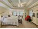 Spacious main bedroom with carpet, sitting area, natural light, and decorative ceiling at 710 Bentgrass Ct, Dacula, GA 30019