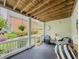 Cozy covered patio with seating and view of the yard at 710 Bentgrass Ct, Dacula, GA 30019