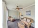 Enclosed porch with wicker furniture, fan and striped indoor/outdoor carpet at 710 Bentgrass Ct, Dacula, GA 30019