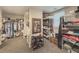 Large walk-in closet featuring shelving, hanging racks, mirror and carpeted floors at 710 Bentgrass Ct, Dacula, GA 30019