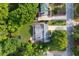 Aerial view of home featuring spacious backyard with trampoline and beautiful surrounding trees at 108 Shawville Ln, Peachtree City, GA 30269