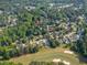 Aerial view of neighborhood with golf course and lush trees at 108 Shawville Ln, Peachtree City, GA 30269