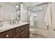 Bright bathroom featuring a single sink vanity, glass-enclosed shower, and subway tile surround at 108 Shawville Ln, Peachtree City, GA 30269