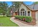 Charming brick home with manicured landscaping and inviting walkway at 108 Shawville Ln, Peachtree City, GA 30269