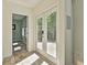 Hallway with wood flooring, a door to an office and a door to the deck at 108 Shawville Ln, Peachtree City, GA 30269